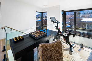 Workout room with wood finished floors
