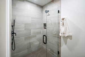 Full bathroom featuring a stall shower