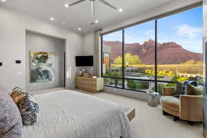 Carpeted bedroom featuring recessed lighting and a ceiling fan