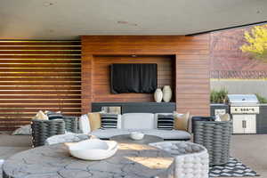 Carpeted living room with wood walls