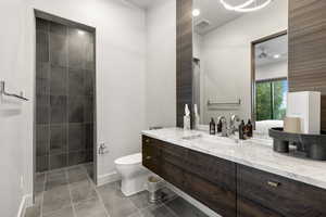 Bathroom with vanity and light tile patterned flooring