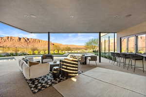 View of patio with a mountain view and an outdoor hangout area