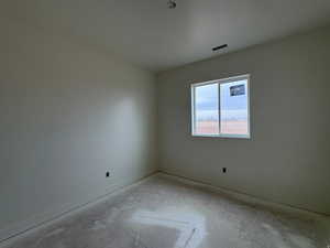 Unfurnished room with baseboards
