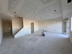 Unfurnished room featuring stairway