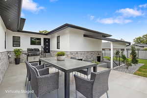 Private patio on the North side of home with example of furniture.