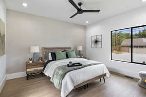 2nd Bedroom on main floor is large with wood floors, recessed lighting, and ceiling fan, and large closet.