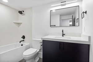 Full Bathroom in basement with vanity and tub / shower combination.