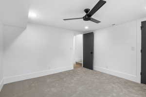 SE basement bedroom with carpet floors, recessed lighting, and a ceiling fan.