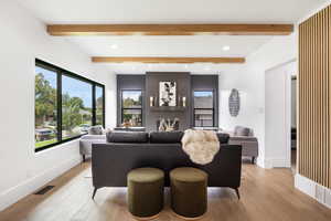 Living area with stone firplace and extra side storage.