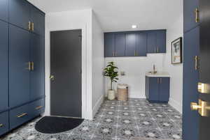Laundry/Mudroom with sink and water filling station.
