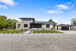 View of East side of home with 2nd entrance and more parking for guests off the main street.