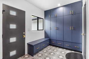 View of mudroom with water filling station.