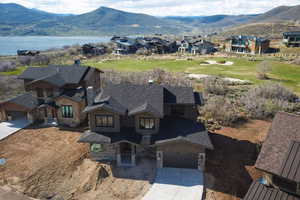 Aerial perspective of suburban area featuring a mountainous background