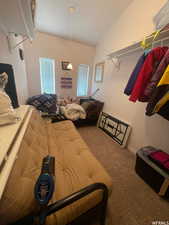 Carpeted bedroom with baseboards