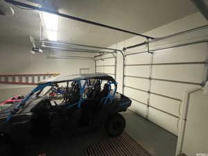 Garage featuring freestanding refrigerator