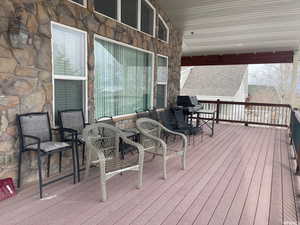 Wooden deck featuring grilling area