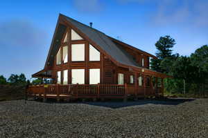 Back of house with a metal roof