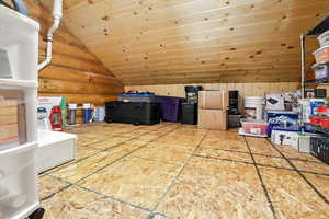 Additional living space featuring lofted ceiling