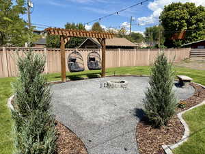 Fire pit has plenty of room for seating and two new egg chairs hanging from arbor
