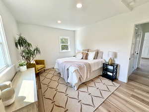 Primary bedroom is large enough for king sized bed, dresser and seating