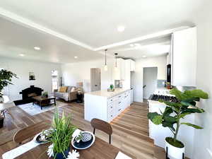 Open Main floor with all new luxury vinyl flooring. The kitchen has quartz counter tops with a waterfall edge