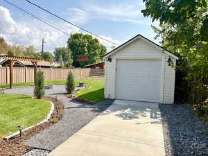 Garage has new door and opener, new roof, paint, and lighting