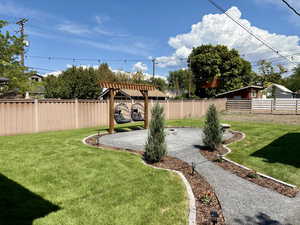 Large fenced yard with custom built fire pit