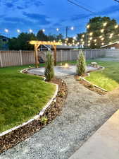 In ground walkway lights, fire pit, and hanging string lights