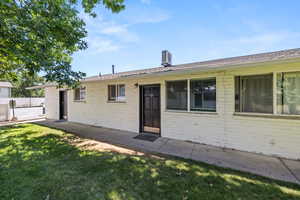 Front of property featuring brick siding,