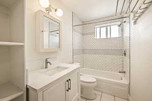 Full bathroom featuring shower / bathtub combination, vanity, and tile patterned flooring