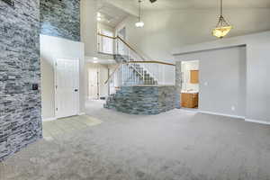 All carpet on the main level and upstairs level is less that 3 weeks old.  Nice walls accent lay with stacked wall tiles. High Shelves makes a great area to display Holiday decorations or your favorite treasures.