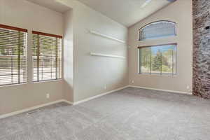 This is the front formal living room with custom shelving for displaying your favorite show off pieces.  The space of the left of the picture has been used for formal dining area.