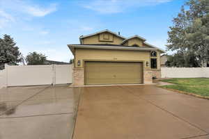 View of front of home.  Both sides of the home have large vinyl gates.  On the Left of the home    there is wide double vinyl gates so that RV and vehicles can be parked behind the gate at the side of the home.  Very spacious RV parking.  On both sides of