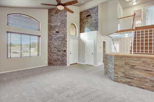 Front entrance to the home. This living room has new carpet, vaulted ceilings, and the window above the entrance door and the two front window on the front wall are new Anderson Windows with custom Wood blinds.