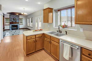 Kitchen with stainless dishwaher, dry eating bar and dining area off of the Great Room.