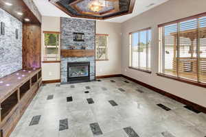 Great Room which features a custom Heatilator fireplace with custom mantel and stacked tile surround,