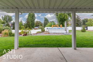 Fenced backyard with a patio area