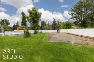 View of fenced backyard
