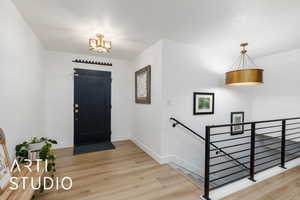Foyer featuring light wood-type flooring