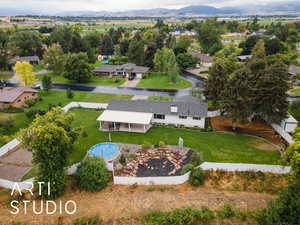 View from above of property with a mountain backdrop