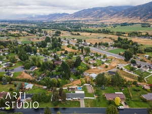 Aerial view of property's location featuring mountains
