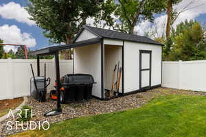 View of shed with a fenced backyard