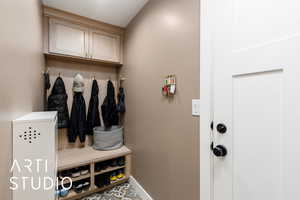 Mudroom featuring baseboards