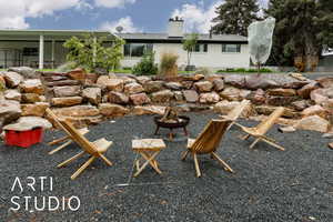 View of yard featuring an outdoor fire pit