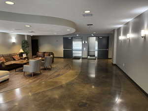 Community lobby featuring recessed lighting
