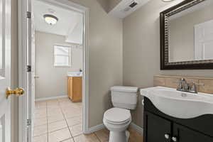 Half bath and laundry right off the garage.