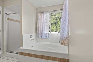 Primary Suite Bathroom with garden tub and separate shower.