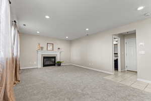 Family room with access to the garage and lower level.