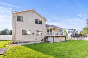Rear view of property with a fenced backyard, stairway, a deck, a patio, and a gate