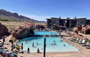 Community pool featuring a patio and a mountain view